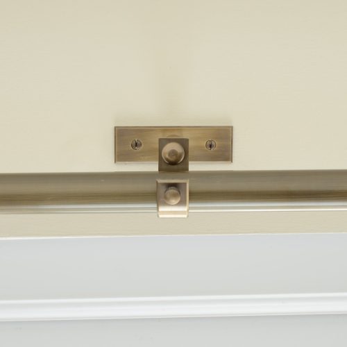 solid brass curtain centre bracket shown with curtain pole
