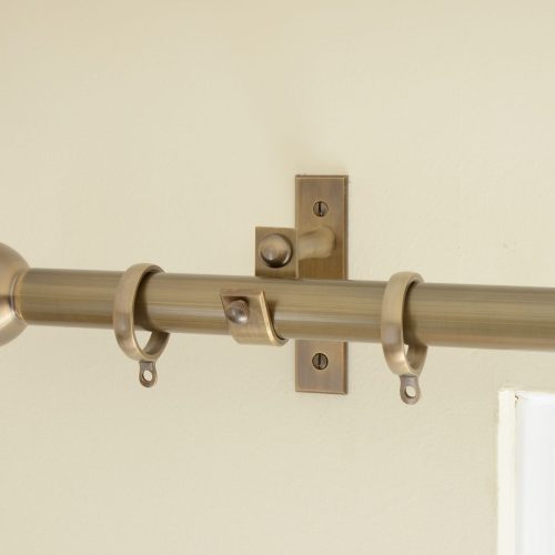 solid brass curtain end bracket shown with curtain pole