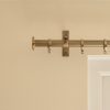 solid brass button shaped curtain finial on curtain pole