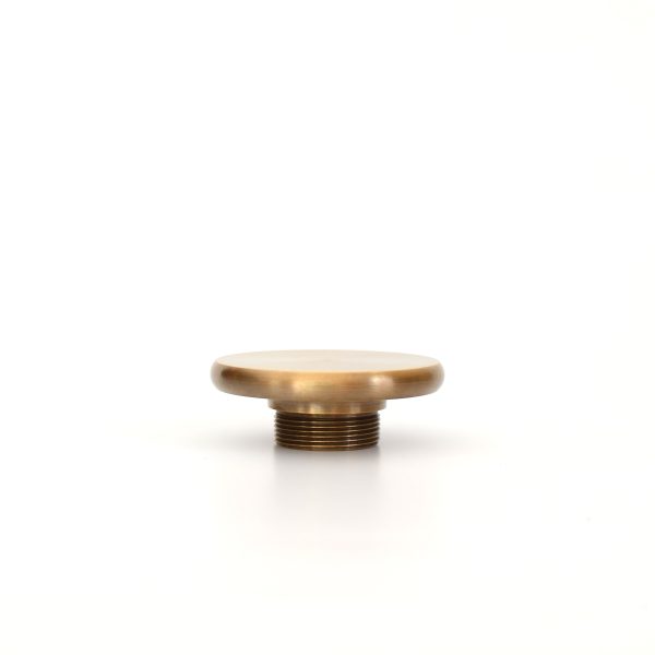 solid brass button shaped curtain finial in antique finish