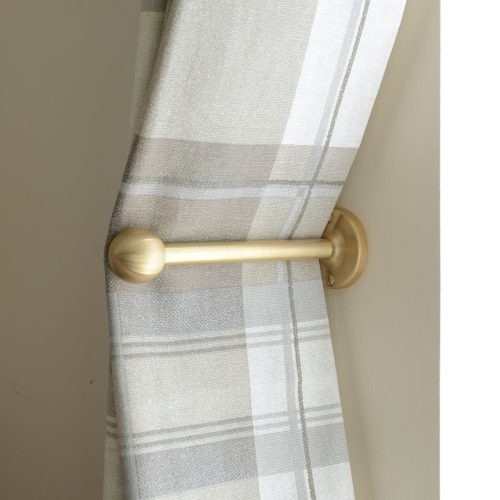 solid brass curtain holdback with ball shaped end shown in use