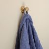 solid brass robe hook with hanging robe