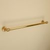 solid brass towel rail mounted to wall