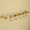 solid brass utility rail mounted to wall