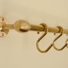 solid brass utility rail mounted to wall