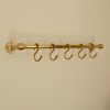 solid brass utility rail mounted to wall