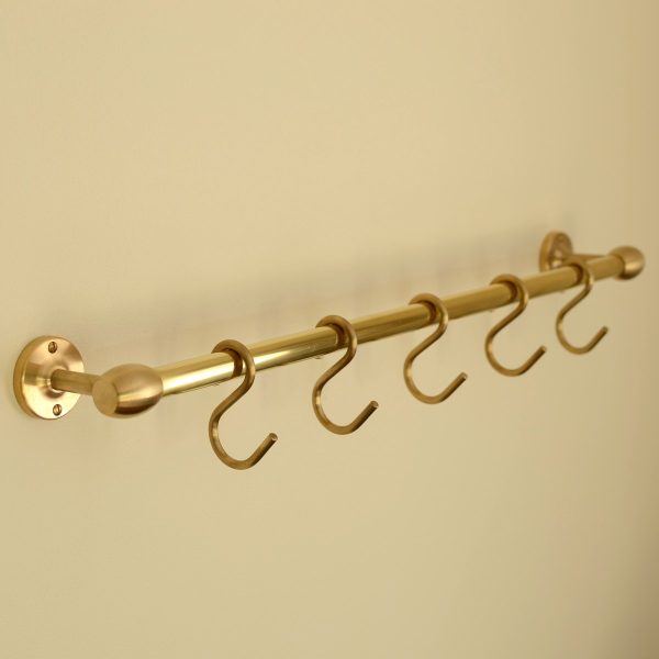 solid brass utility rail mounted to wall